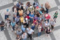 Top view group of unknown tourists waiting at the old town square in the center of Prague, Czech Republic