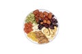 Top view group of whole grains and dried fruit in a glass plate. Royalty Free Stock Photo