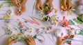 Top view group of woman hand work with yarn to make handmade product, colorful tiny flower crochet as rose, daisy, fern leaf,