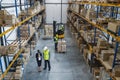 Top view of group of workers with manager indoors in warehouse, coronavirus concept.