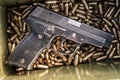 Top view of gun and ammunition box on the table Royalty Free Stock Photo