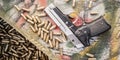 Top view of gun and ammunition box on the table Royalty Free Stock Photo