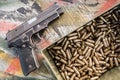 Top view of gun and ammunition box on the table Royalty Free Stock Photo