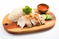 Top View, Hainanese Chicken Rice On A Wooden Boardon White Background Royalty Free Stock Photo