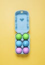 Top view of half dozen dyed easter eggs in egg carton container Royalty Free Stock Photo