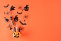 Top view of Halloween crafts, orange pumpkin, ghost, bat and spider on orange background with copy space for text. halloween Royalty Free Stock Photo