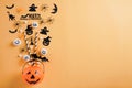 Top view of Halloween crafts, orange pumpkin, ghost, bat and spider on orange background with copy space for text. halloween Royalty Free Stock Photo