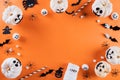 Top view of Halloween crafts, orange pumpkin, ghost, bat and spider on orange background with copy space for text. halloween Royalty Free Stock Photo