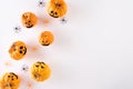 Top view of Halloween crafts, orange pumpkin, ghost, bat and spider on white background with copy space for text. halloween Royalty Free Stock Photo