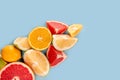 Top view of halves of citrus fruits. Citrus Pattern On Blue background. flatlay. fresh Cool Summer Lemonade. top view