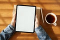 Top view hand of asian women are using tablet on wood table