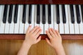 Top view of a hand, a child piano keyboard. Small child's hand o Royalty Free Stock Photo