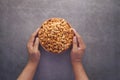 top view of hand hold a bowl of cashew nut