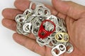 Top view of Hand holding aluminum ring pull on white paper Background Royalty Free Stock Photo