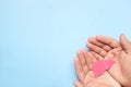 Top view of hand holding liver cutout. Liver health care and protection, hepatitis awareness and organ transplant concept. Royalty Free Stock Photo