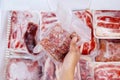 Top view of hand picking a pack of cube red meat Royalty Free Stock Photo