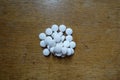 Top view of handful of white pills