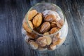 top view of handmade baked nuts with boiled condensed milk in glass jar