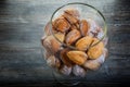 top view of handmade baked nuts with boiled condensed milk in glass jar