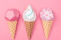 Top view of handmade colorful origami ice cream cones isolated on pink. Royalty Free Stock Photo