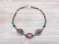 Necklace from natural gemstones on wooden table Royalty Free Stock Photo