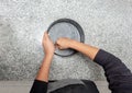 Top View of hands greasing a cake mould in the kitchen