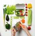 Top view of hands prepare light healthy eating dinner salad with ingredients carrot