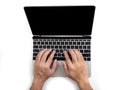 Top view of hands typing on computer laptop on white isolated background with clipping path. Royalty Free Stock Photo