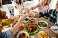 Cheerful people celebrating thanksgiving day together at home Royalty Free Stock Photo