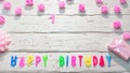 Top view of happy birthday 1 candle letters for a girl in pink shades with beautiful rose flowers, postcard congratulation copy Royalty Free Stock Photo