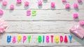 Top view of happy birthday 55 candle letters for a girl in pink shades with beautiful rose flowers, postcard congratulation copy Royalty Free Stock Photo