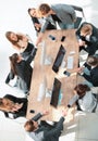 Top view. happy employees shaking hands during a meeting Royalty Free Stock Photo
