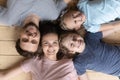 Top view of happy family with kids lying on floor Royalty Free Stock Photo