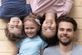 Top view of happy family with kids relaxing on floor Royalty Free Stock Photo