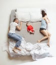 Top view of happy family with one newborn child in bedroom. Royalty Free Stock Photo