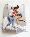 Top view of happy family with one newborn child in bedroom. Royalty Free Stock Photo