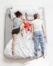 Top view of happy family with one newborn child in bedroom. Royalty Free Stock Photo