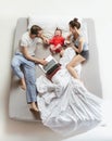 Top view of happy family with one newborn child in bedroom. Royalty Free Stock Photo