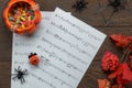 Top view of Happy Halloween Festival and music note sheet background concept. Royalty Free Stock Photo