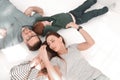 Top view. happy parents with children lying on the floor Royalty Free Stock Photo