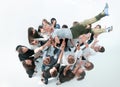 Top view.happy team of young people tossing up their leader.