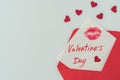 top view of happy valentines day postcard with lips print in envelope Royalty Free Stock Photo