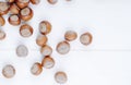 top view of hazelnuts scattered on white background with copy space Royalty Free Stock Photo
