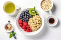 top view of a healthy breakfast: oatmeal, berries, and green tea