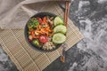 Top view Healthy and delicious vegetarian vegetable bowl with bulgur, white beans, sweet pepper, broccoli and fresh cucumber