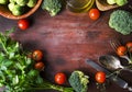 Top view of healthy food ingredients frame on vintage wooden table. Superfood vegetable mix border on rustic background from above Royalty Free Stock Photo