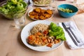 Top view of healthy, fresh, organic homemade table spread with cooked salmon, green salad, guacamole, , rice and fried platano on