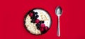 Top view on healthy organic vegetarian breakfast, spoon and bowl of muesli and yoghurt with fresh berries strawberry, currant and Royalty Free Stock Photo