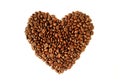 Top view of heap of roasted coffee beans in heart shaped isolated on white background Royalty Free Stock Photo