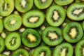 Top view of heap of sliced kiwi as background